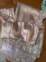 Vasundhara Fashions lavender tissue netted saree with intricate sequin embroidery and matching satin blouse