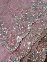 Vasundhara Fashions pink organza saree with intricate floral embroidery, pearl accents, and sparkling crystal borders.