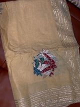 Vasundhara Fashions Kora embroidery saree in beige with silver gota patti borders and floral threadwork motif