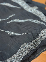 Vasundhara Fashions black soft organza saree featuring intricate silver beadwork and sequin embroidery detailing.