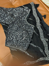 Vasundhara Fashions black soft organza saree featuring intricate silver sequin embroidery and a matching blouse