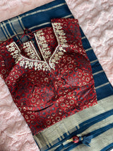 Vasundhara Fashions blue tissue saree with a maroon patterned blouse featuring intricate gold embroidery