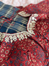 Vasundhara Fashions blue and maroon tissue saree with intricate floral embroidery and traditional geometric patterns