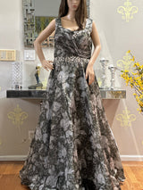 Vasundhara Fashions bottle green organza long gown with floral digital print and embellished waist on a mannequin