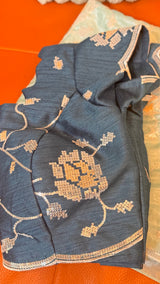 Vasundhara Fashions dark teal organza saree blouse with intricate gold sequin floral embroidery and textured fabric