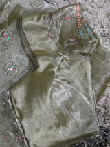 Vasundhara Fashions green organza saree featuring intricate floral embroidery and a matching stitched designer blouse.