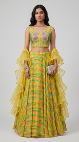 Vasundhara Fashions green printed organza lehenga with a sleeveless embellished blouse and ruffled swirl dupatta.