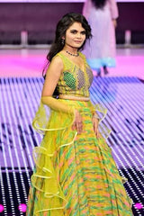 Vasundhara Fashions green printed organza lehenga with a swirl dupatta worn by a model on a runway