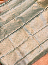 Vasundhara Fashions light green Kanchipuram pattu silk saree with intricate silver zari peacock and teardrop motifs