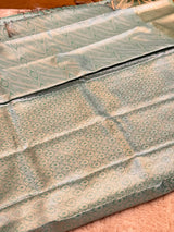 Vasundhara Fashions mint green Kanchipuram pattu silk saree with intricate silver zari paisley and floral motifs