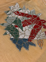 Vasundhara Fashions Kora embroidery saree featuring a detailed floral motif with red, green, and silver threadwork.