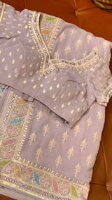 Vasundhara Fashions lavender chiffon saree with intricate multi-colored floral Chikankari embroidery and sequin work.