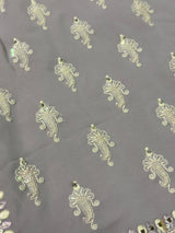 Vasundhara Fashions lavender chiffon saree featuring intricate white Chikankari embroidery with shimmering sequin accents