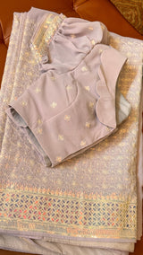 Vasundhara Fashions lavender saree with intricate Chikankari embroidery, sequin border, and scalloped puff-sleeve blouse