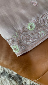 Vasundhara Fashions lavender tissue netted saree featuring intricate floral embroidery with sequins and beadwork