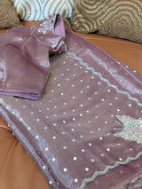 Vasundhara Fashions lavender organza saree featuring silver sequin polka dots and an intricate embroidered border.