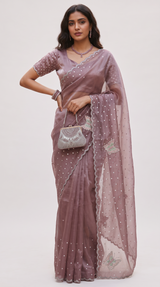 Model wearing a Vasundhara Fashions lavender organza saree with delicate sequin embroidery and butterfly motifs