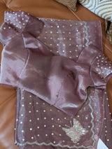 Vasundhara Fashions lavender organza saree featuring silver sequin polka dots and a butterfly embroidery detail.
