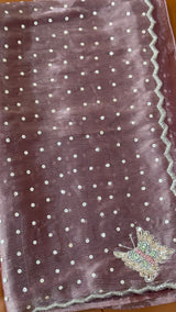 Vasundhara Fashions lavender organza saree featuring scattered silver sequins and a decorative butterfly motif border
