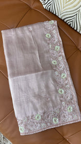 Vasundhara Fashions lavender tissue netted saree featuring intricate floral embroidery with sequins and beadwork.
