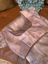 Vasundhara Fashions lavender tissue netted saree featuring delicate sequin embroidery on a satin blouse