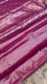 Vasundhara Fashions magenta Kanchipuram pattu silk saree with intricate silver zari floral and geometric patterns.