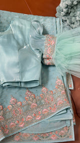 Vasundhara Fashions mint green crepe saree with intricate floral embroidery and matching stitched blouse with tulle