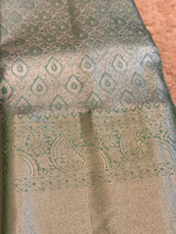 Vasundhara Fashions mint green Kanchipuram pattu silk saree with intricate silver jari paisley and teardrop patterns