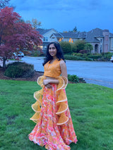 Vasundhara Fashions orange organza croptop lehenga with digital floral print and ruffled dupatta worn by a woman