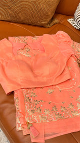 Vasundhara Fashions peach chiffon saree with intricate gold embroidery, sequin work, and matching blouse.
