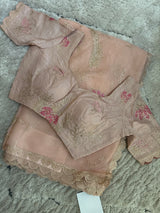 Vasundhara Fashions peach Kora saree with intricate floral embroidery, scalloped borders, and matching blouse
