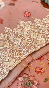 Vasundhara Fashions pink Chikankari saree with intricate beige floral embroidery and delicate sequin detailing