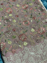 Vasundhara Fashions pink Chikankari saree featuring intricate floral embroidery and detailed paisley border work.