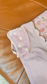 Vasundhara Fashions pink Chikankari saree featuring intricate floral embroidery and a matching stitched blouse.