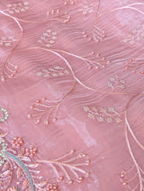 Vasundhara Fashions pink organza saree featuring delicate floral embroidery with pearl and sequin embellishments