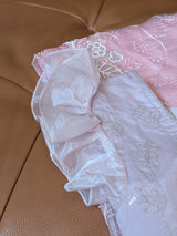 Vasundhara Fashions pink organza saree with delicate silver sequin embroidery and ruffled sleeve detail