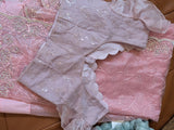 Vasundhara Fashions pink organza saree with intricate sequin embroidery and a matching stitched blouse