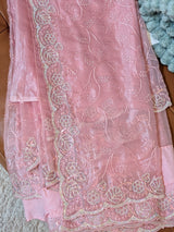 Vasundhara Fashions pink organza saree featuring delicate floral embroidery and intricate pearl beadwork border