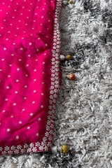 Vasundhara Fashions pink pearl saree featuring intricate beadwork border and decorative tassel details