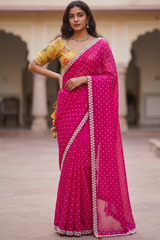 Vasundhara Fashions pink pearl embellished saree paired with a contrast yellow patterned blouse for party wear