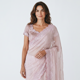 Vasundhara Fashions light pink and purple organza saree with delicate embroidery and sequin detailing on a model