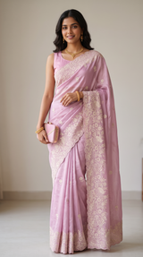 Vasundhara Fashions pastel pink tissue saree with intricate floral Resham embroidery and elegant cutwork border