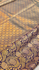 Vasundhara Fashions purple and gold mix pattu silk saree with intricate floral and leaf jacquard weave patterns.