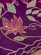 Vasundhara Fashions Kora embroidery saree featuring purple fabric with intricate gold threadwork and sequin lotus motifs
