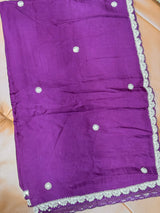 Vasundhara Fashions deep purple Kora saree featuring delicate white floral embroidery and an intricate scalloped border.