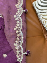 Vasundhara Fashions purple soft organza saree with intricate floral embroidery, sequin work, and decorative tassels.