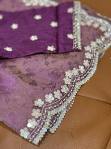 Vasundhara Fashions purple soft organza saree featuring delicate self-print patterns and intricate sequin floral border