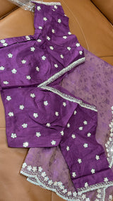 Vasundhara Fashions purple organza saree with self-print patterns and matching blouse featuring silver floral embroidery