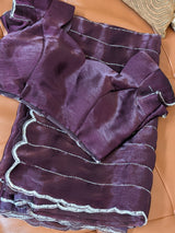 Vasundhara Fashions purple organza saree with silver horizontal lines and a scalloped beaded border with blouse piece