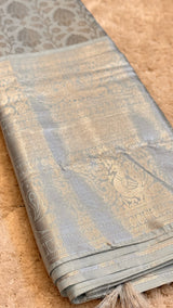 Vasundhara Fashions silver Kanchipuram pattu silk saree with intricate metallic silver zari peacock motifs